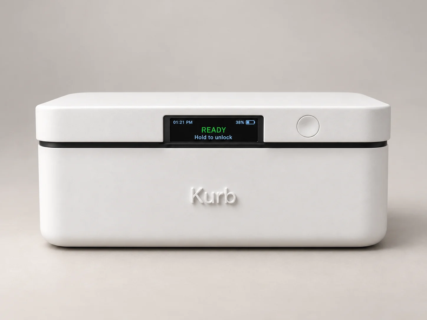 Front view of the white Kurb Home pilot device, with its display showing READY and Hold to unlock beside the round button